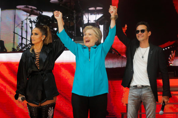 U.S. Democratic presidential nominee Hillary Clinton joins performers Jennifer Lopez and Marc Anthony at a campaign concert in Miami, Florida, U.S. October 29, 2016.  REUTERS/Brian Snyder